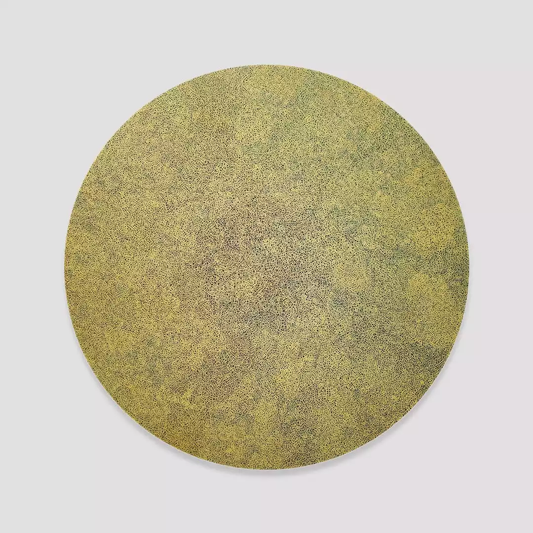 Extra fine gold scribble filling a black circle