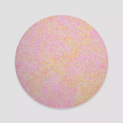 Medium pink and yellow scribbles filling a white circle